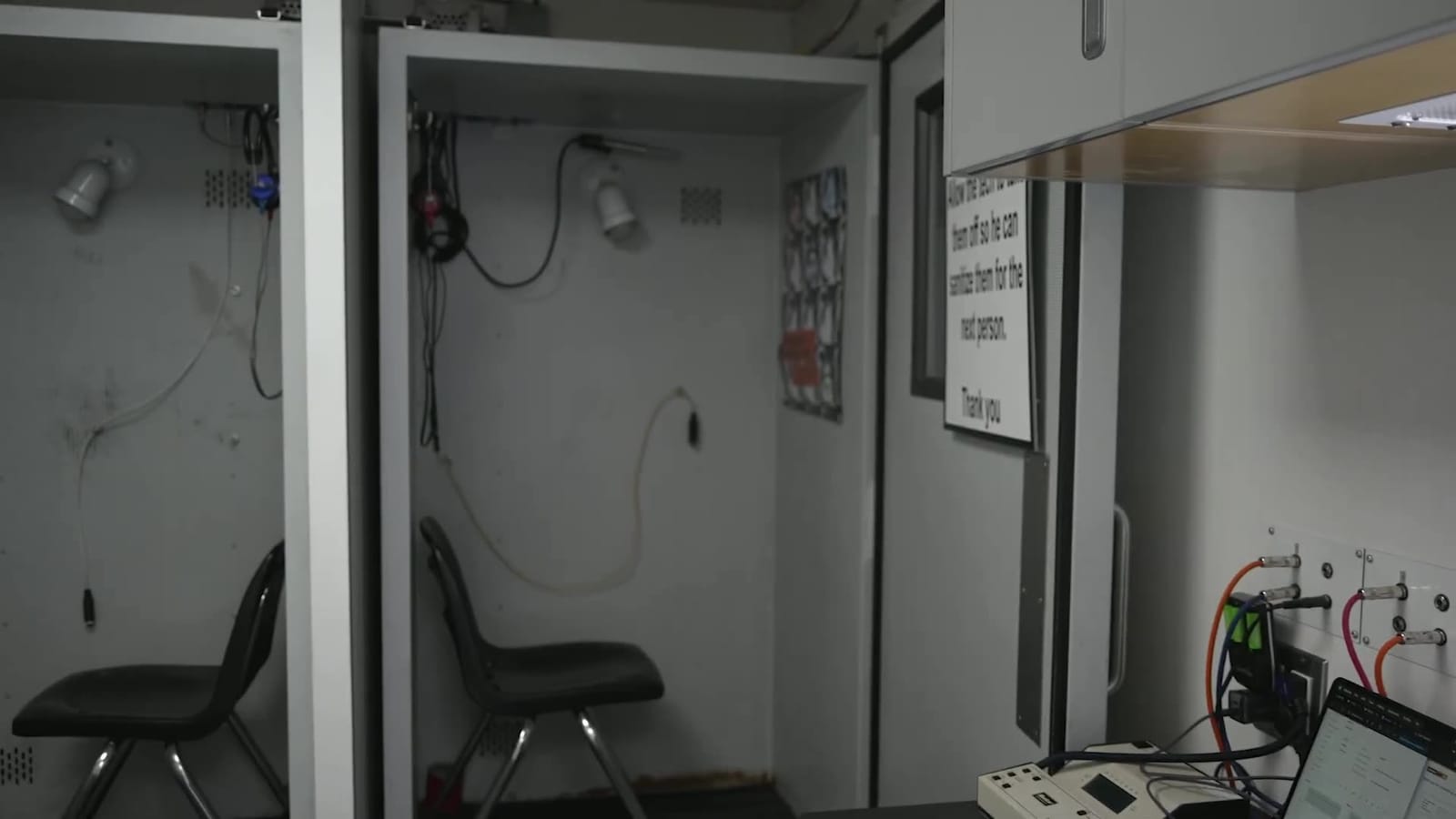 Two sound-insulated hearing test booths side by side inside the mobile unit