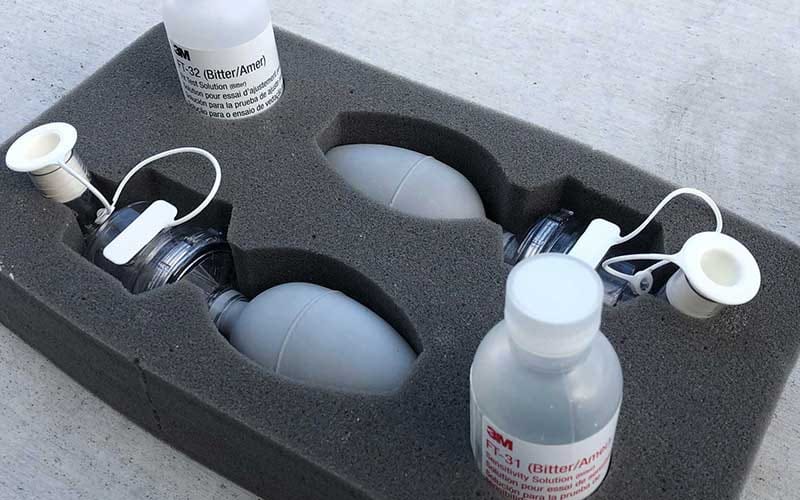 Qualitative respirator fit test kit with nebulizers and bitter test solution in a foam case